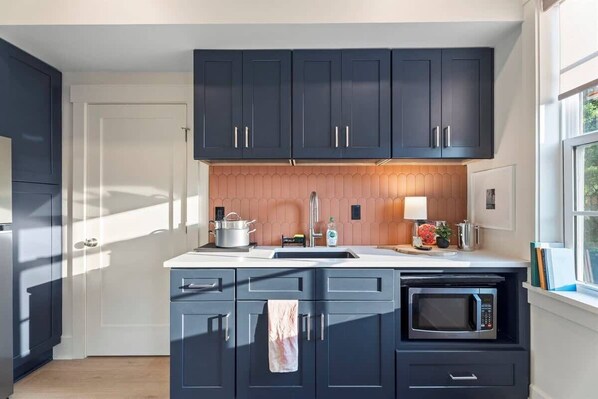 Fridge, microwave, cookware/dishes/utensils