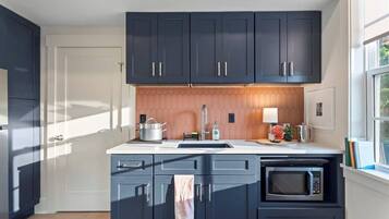 Fridge, microwave, cookware/dishes/utensils