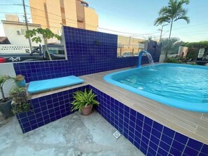 Family Quadruple Room, Air conditioning, Pool View | Living area