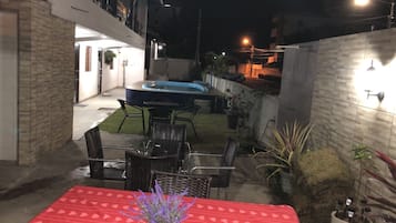 Family Quadruple Room, Air conditioning, Pool View | Living area