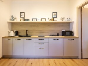 Fridge, microwave, cookware/dishes/utensils
