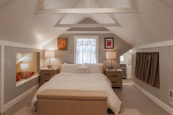 The Loft bedroom has a comfortable queen bed, luxurious linens and a cute built in Twin Bed. Access to the play room is just off to the right