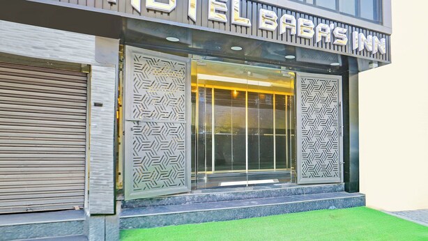 A modern building with a sign reading "HOTEL BABAS INN". - FabHotel Baba's Inn (New Delhi)