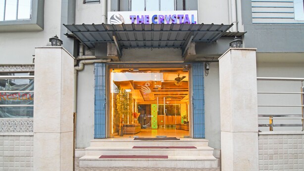 A hotel entrance with a sign reading "THE CRYSTAL". - Fabhotel The Crystal (Kolkata)