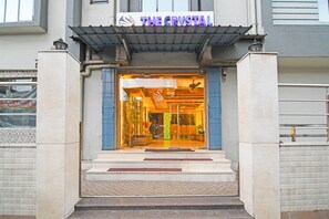 A hotel entrance with a sign reading "THE CRYSTAL". - Fabhotel The Crystal (Kolkata)