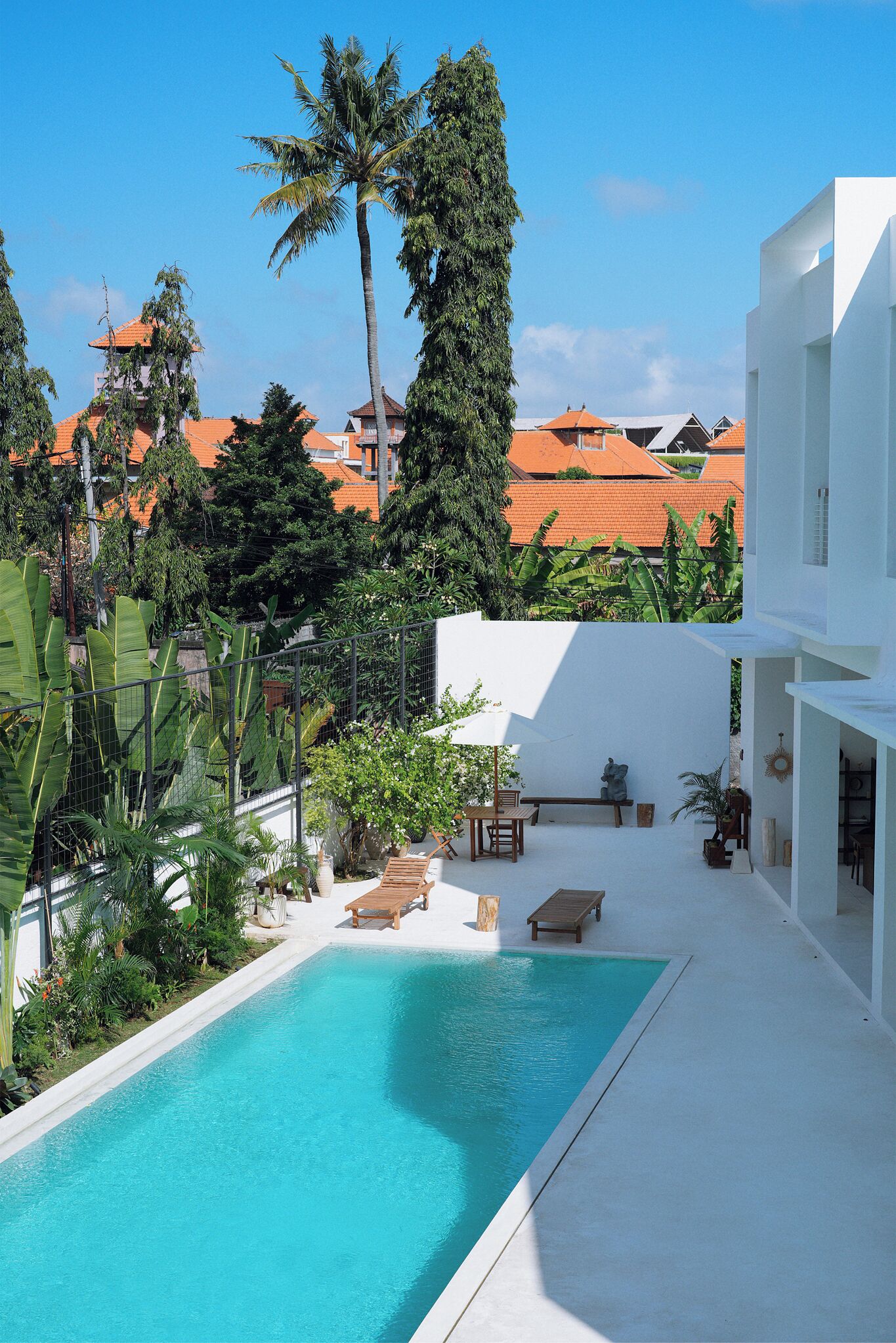 Outdoor pool, open 6:00 AM to 10:00 PM, pool loungers