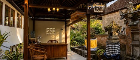 A traditional wooden structure with a sign reading 'Mambul Ubud.'