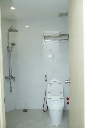 Shower, hair dryer, towels, soap