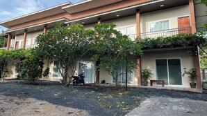 A two-story building with a covered entrance, large windows, and a balcony. - Cozy near Samui airport (Chang Wat Surat Thani)