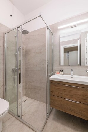 Shower, hair dryer, towels, soap