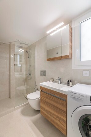 Shower, hair dryer, towels, soap