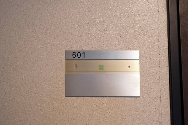 A wall-mounted sign with the number 601, indicating a room or location.