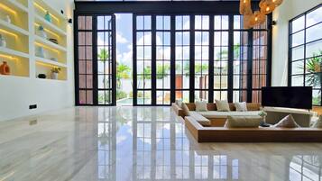 Villa, Pool View | Living area | Flat-screen TV