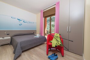 Deluxe Suite, Patio, Garden View | In-room safe, desk, blackout curtains, soundproofing