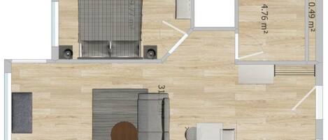 A floor plan of a hotel room with a bed, a seating area, a kitchenette, and a bathroom.