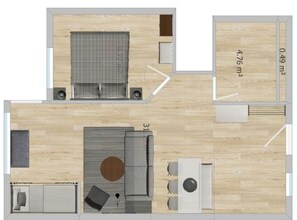 A floor plan of a hotel room with a bed, a seating area, a kitchenette, and a bathroom. - Apartment in Gerlitzen with Panoramic Views (Treffen am Ossiachersee)