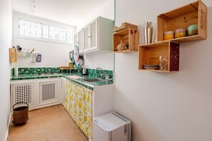 Fridge, oven, electric kettle, cookware/dishes/utensils