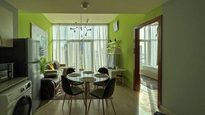 Deluxe Penthouse, 1 Bedroom, Balcony, Canal View | Living area | 55-inch Smart TV with cable channels