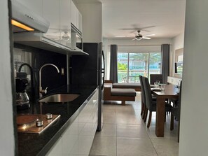 Fridge, microwave, stovetop, coffee/tea maker