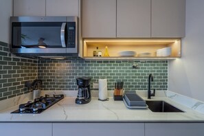 Fridge, microwave, coffee/tea maker, toaster