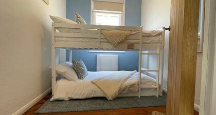 St James Dairy, house by the harbour. 5 minute walk to tunnels beaches. Sleeps 8