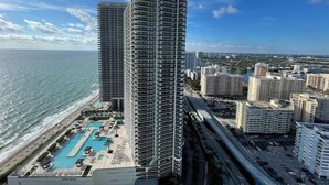 A high-rise hotel with a rooftop pool and ocean views. - Wonderful Views at Lyfe Resort @rent4us (Hollywood)