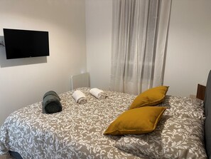 2 dormitorios, tabla de planchar con plancha, wifi y ropa de cama