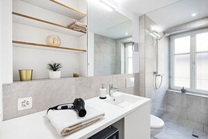 Design Apartment, 1 Bedroom, City View | Bathroom | Shower, hair dryer, slippers, towels