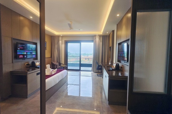 Premium Double Room, Balcony, Garden View | In-room safe, desk, laptop workspace, iron/ironing board