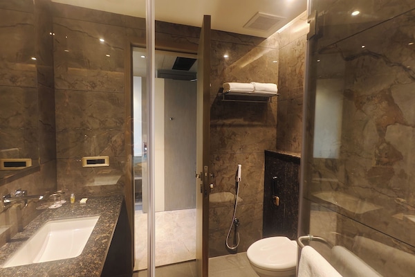 Shower, slippers, towels, soap
