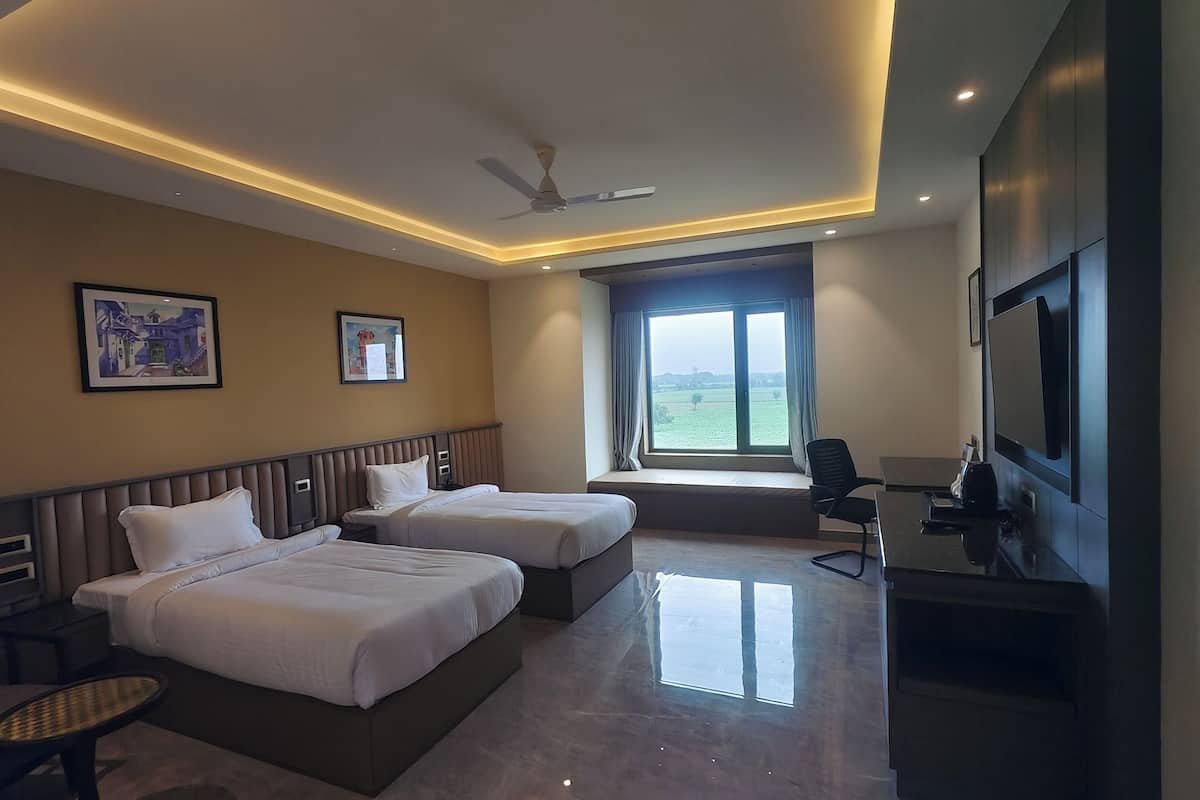 Superior Twin Room, Garden View | In-room safe, desk, laptop workspace, iron/ironing board