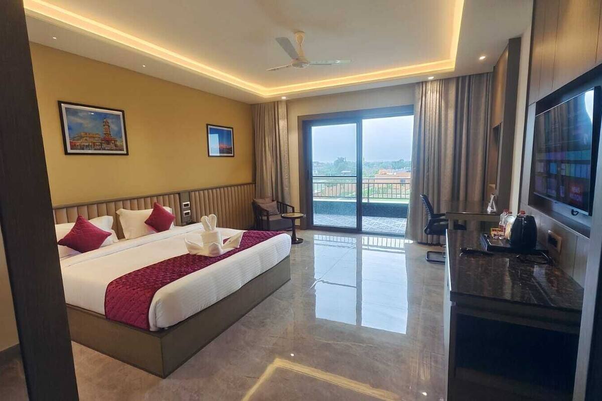 Premium Double Room, Balcony, Garden View | In-room safe, desk, laptop workspace, iron/ironing board