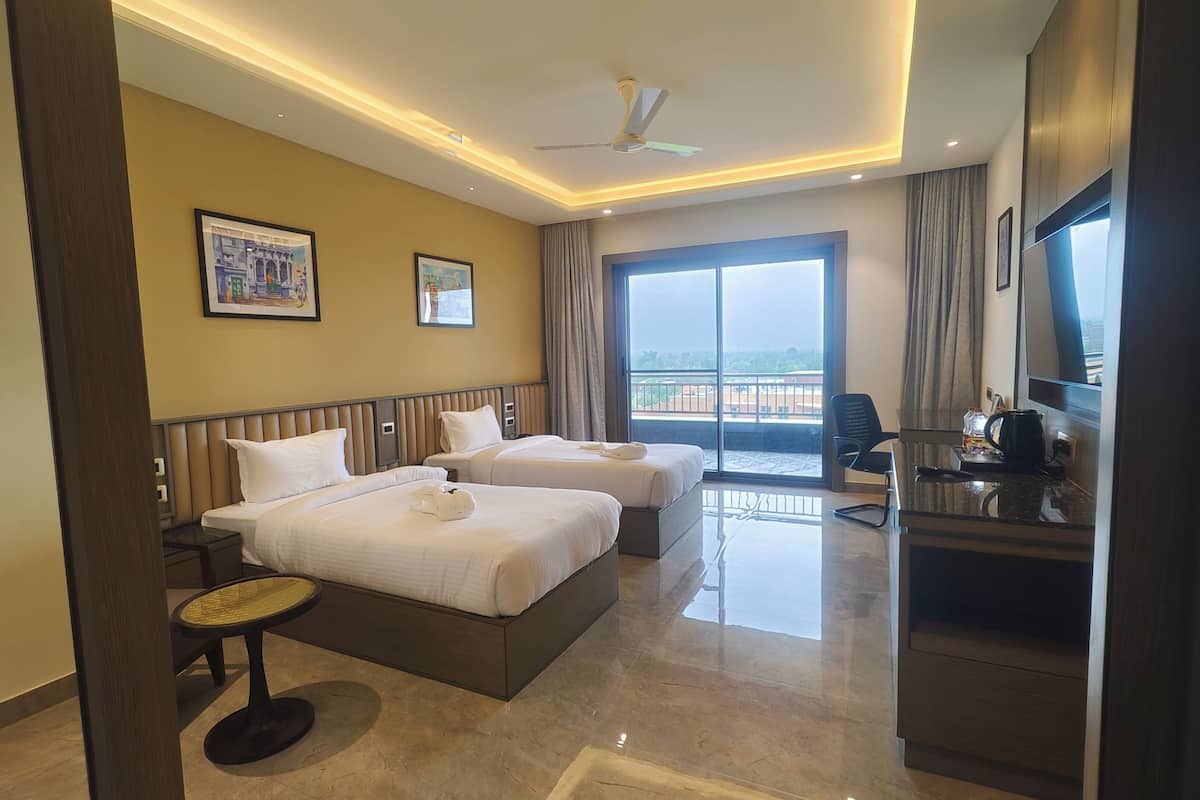 Premium Twin Room, Balcony, Garden View | In-room safe, desk, laptop workspace, iron/ironing board