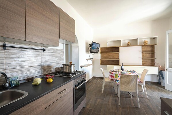 Family Apartment, 2 Bedrooms, Sea Facing (Torre Dell'Orso Nice Sea View) | Private kitchen | Fridge, microwave, stovetop, coffee/tea maker
