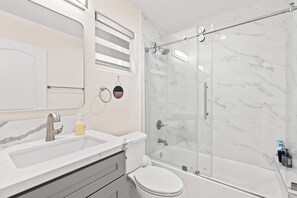 Shower, hair dryer, towels