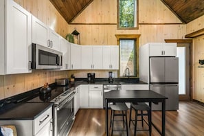 Fridge, microwave, oven, stovetop - Luxury Lakefront Cabin • Hot Tub & Lake Access (Smoky Mountains)