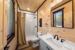 Shower, hair dryer, towels, shampoo