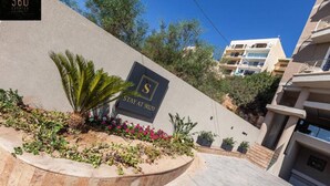 A hotel entrance with a sign reading "STAY AT 9020" and a palm tree in the foreground. - STAY AT 9020 (St. Paul's Bay)