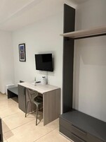 Quadruple Room, 2 Queen Beds, Non Smoking | In-room safe, desk, laptop workspace, blackout drapes