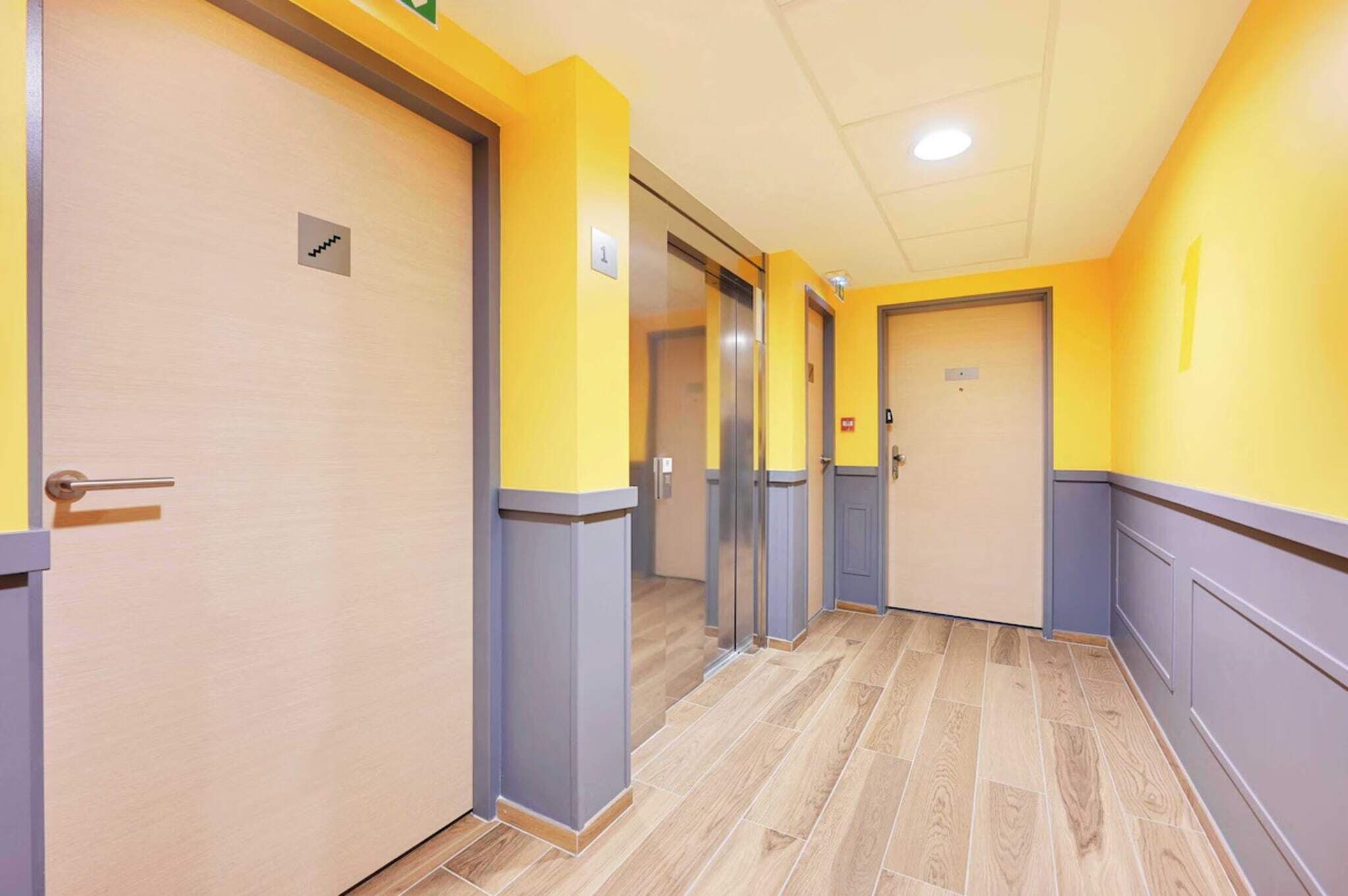 A hallway with doors, each marked with a number.