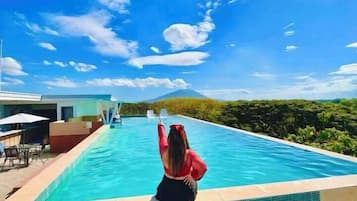 Outdoor pool, open 8:00 AM to 10:00 PM, free pool cabanas