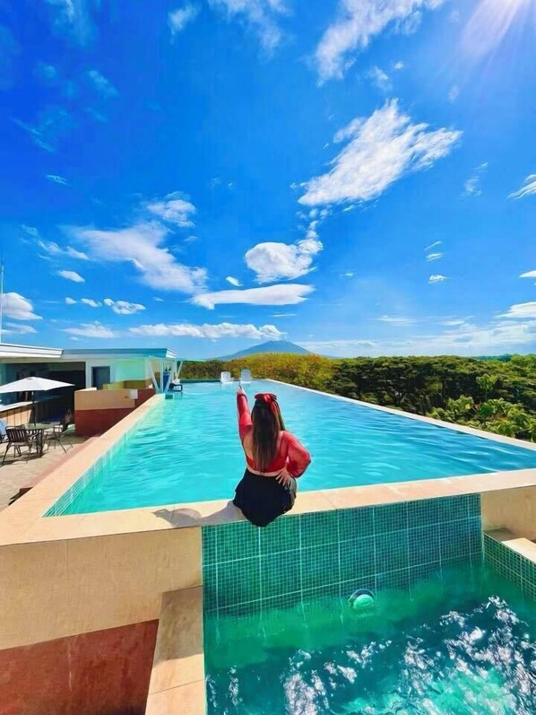 Outdoor pool, open 8:00 AM to 10:00 PM, free pool cabanas