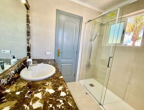 Shower, hair dryer, towels, soap