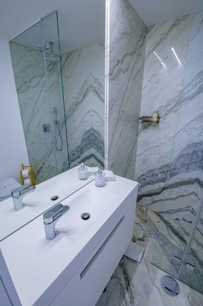 Shower, hair dryer, towels, soap