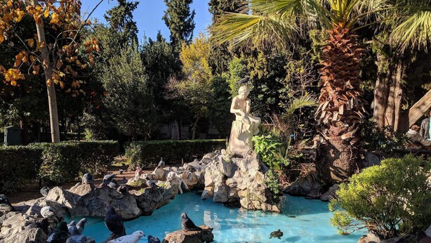 A serene garden with a clear blue pool surrounded by rocks and various trees. - Lovehome-4BD Villa with views,dinners-close to airport, MEC ΑΕ,bus stop, Railway (Gerakas)