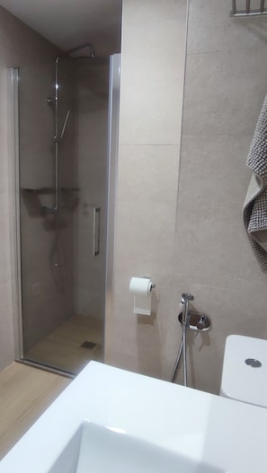 Shower, hair dryer, towels, soap