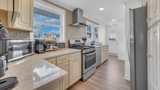 A modern kitchen with a built-in stove, oven, and microwave. - 2 BR Ocean Block Home (Seaside Park)