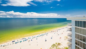 A beach with clear skies and calm waters. - Phoenix Gulf Shores Ii 2001 4 Bedroom Condo (Gulf Shores)