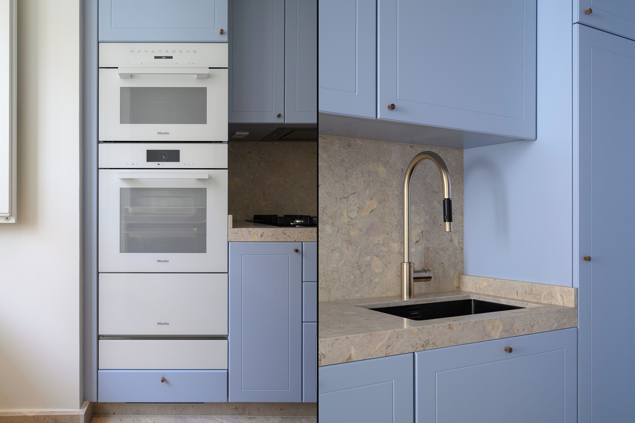 Una cocina compacta con electrodomésticos integrados, un lavamanos y una encimera.