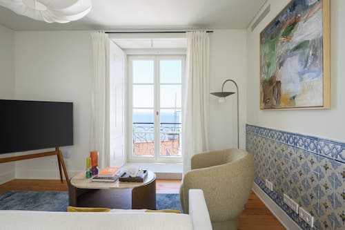 Deluxe Apartment, 2 Bedrooms | Living area | 50-inch flat-screen TV with cable channels